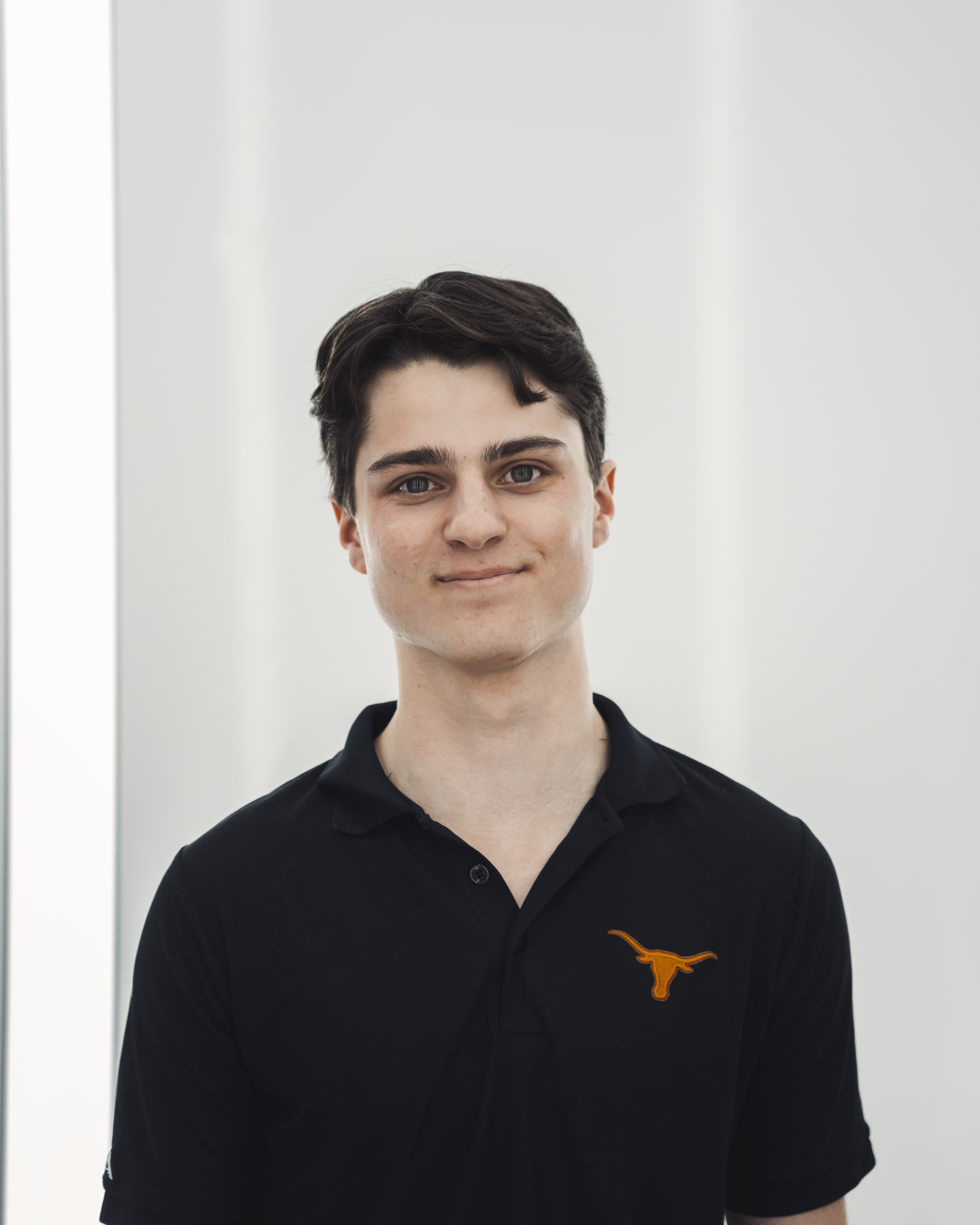 Laptop, notebook, and coffee on a desk for studying MIS.